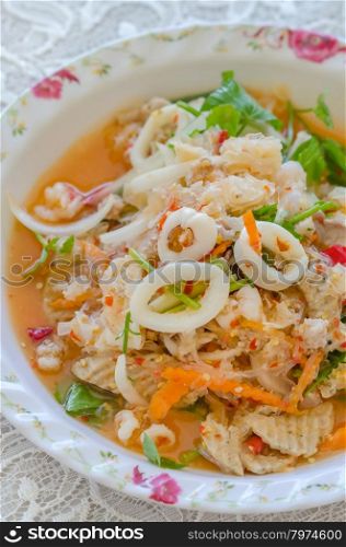 spicy seafood salad. close up spicy mix salad with seafood and fresh vegetable
