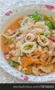 spicy seafood salad. close up spicy mix salad with seafood and fresh vegetable