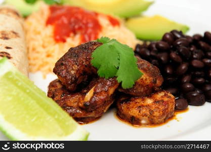 Spicy Shrimp Closeup. Shrimp cooked in Jamaican spices for tacos with black beans and Spanish rice, lime cilantro, cheese and hot sauce.