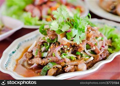 spicy slices pork on dish , mix vegetable and chili sauce