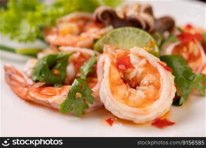 Spicy Squid and Shrimp Salad in White Dish with Lemon Cilantro and lettuce.