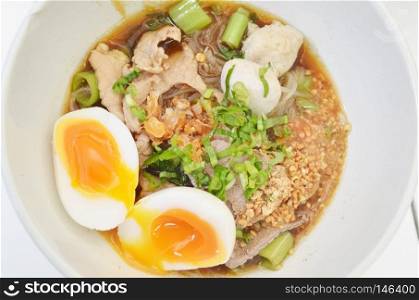 spicy thai noodles with eggs shot closeup