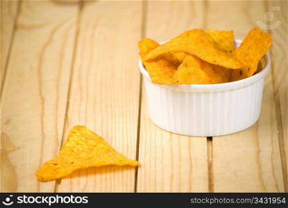 spicy tortilla chips over wooden board