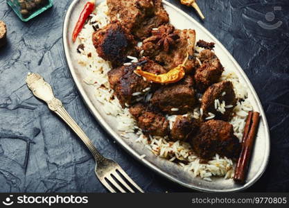 Spicy vindaloo meat with rice. Pork cooked in spicy garlic sauce. Vindaloo, meat in fried spices.