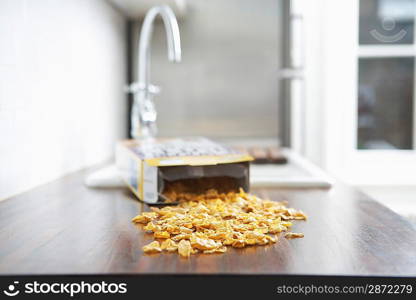 Spilled cereal on kitchen counter