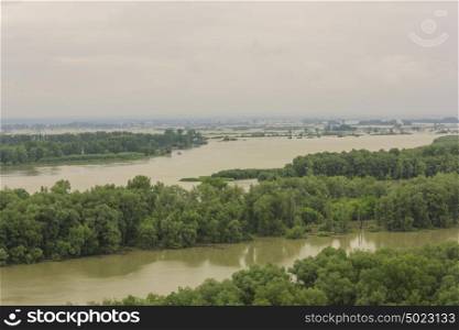 Spilling river in a green forest natural background. Spilling river in a green forest natural background.