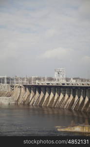 Spillway of river dam at sunny day