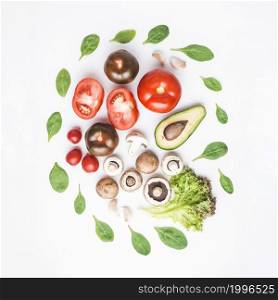 spinach around vegetables mushrooms