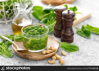 Spinach pesto sauce with cashew, parmesan cheese and olive oil