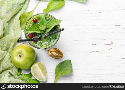 Spinach with smoothie and apple. detox cocktail smoothie with smoothie,mint and apple on white background.copy space
