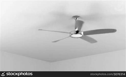 Spinning ceiling fan in the room