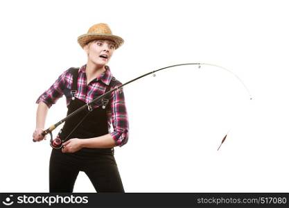 Spinning equipment, angling, cheerful fisherwoman concept. Happy woman in sun hat holding fishing rod, having fun while hunting for fish. Happy woman in sun hat holding fishing rod