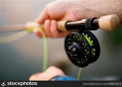 Spinning fishing (lure fishing) trout in lakes of the world. Brook trout (steelhead rainbow trout, char, bull-trout, cutthroat, lax, salmon and pink salmon caught on rotating spinner, close up photography