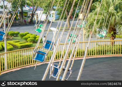 Spinning swings without people at carnival fair