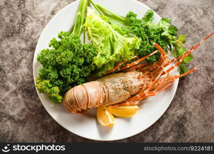 spiny lobster food on plate, fresh lobster or rock lobster seafood with herb and spices lemon coriander parsley lettuce salad, lobster for cooking food - top view
