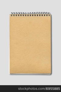 Spiral closed notebook mockup, brown paper cover, isolated on grey. Spiral closed notebook mockup