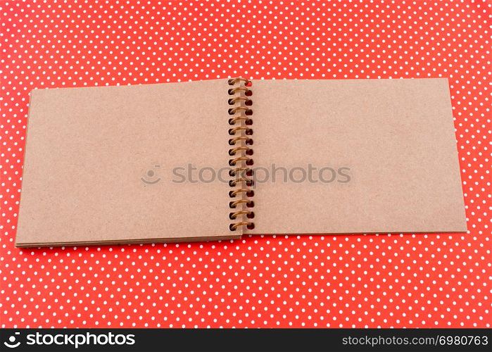 Spiral Notebook on a red background