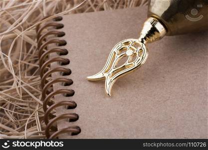 Spiral notebook placed on a straw background