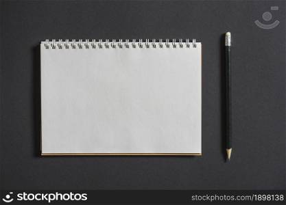 spiral notebook with pencil grey background. Resolution and high quality beautiful photo. spiral notebook with pencil grey background. High quality beautiful photo concept