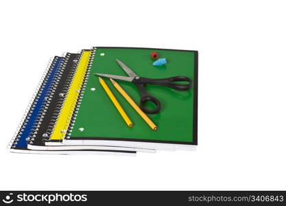 Spiral notebooks with scissors pencils and erasers on white background