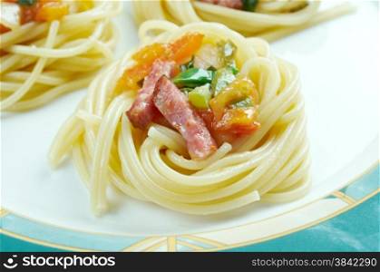 spiral squash spaghetti noodles with sausage and vegetable sauce .