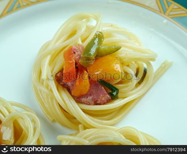 spiral squash spaghetti noodles with sausage and vegetable sauce .