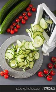spiralizing cucumber vegetable with spiralizer
