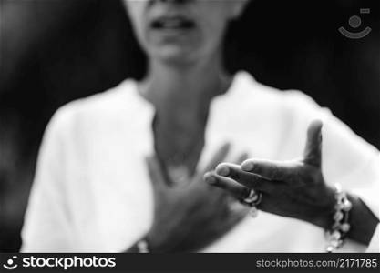 Spiritual Healer Expressing Honesty with her Hands . Honesty Hand Gesture
