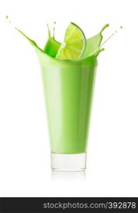 Splash in a glass of green smoothie or yogurt from lime slice isolated on white background. Splash in glass of green smoothie or yogurt from lime slice