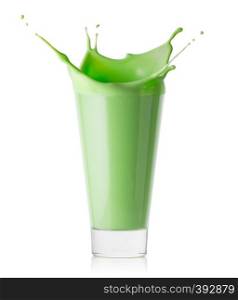 Splash in a glass of green smoothie or yogurt isolated on white background. Splash in glass of green smoothie or yogurt