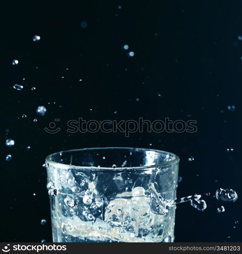 splash in glass on dark background