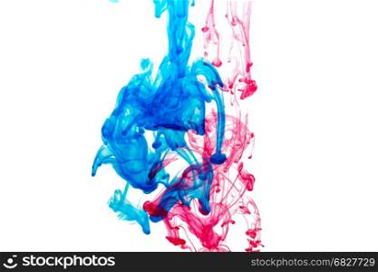 Splash of blue and red paint in water. Abstract background