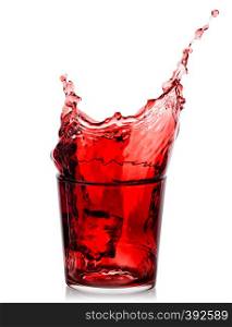 Splash of cherry juice in a low glass isolated on a white background. Splash of cherry juice in low glass