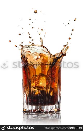 splash of cola in glass isolated on white