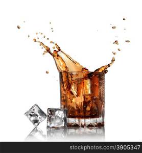 splash of cola in glass with ice cubes isolated on white