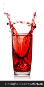Splash of natural cherry juice in a transparent glass isolated on a white background. Splash of natural cherry juice in transparent glass
