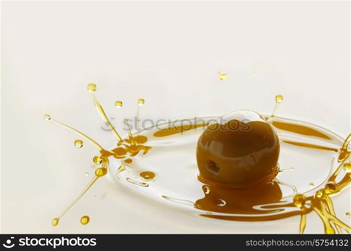 Splash of olive fruit in oil close-up view. Olive oil splash