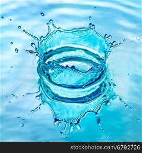 Splash water on blue background