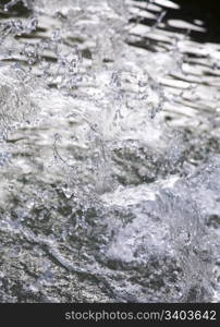 Splashes of water in city fountain