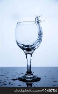 splashing in a glass of clean drinking water on a black glass table