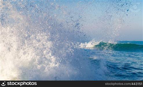 splashing wave near the coast in Brittany, France