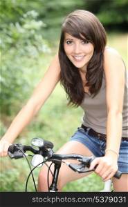 splendid-looking brunette on her bike