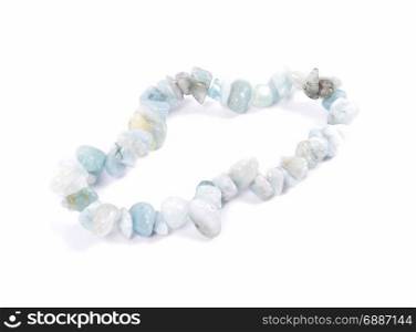 Splintered aquamarine chain on white background