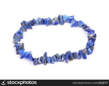Splintered lapis lazuli chain on white background