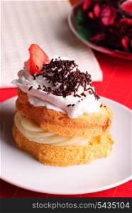 Sponge cake with custard and whipped cream