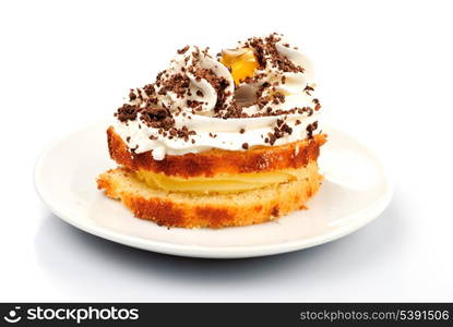 Sponge cake with custard and whipped cream isolated