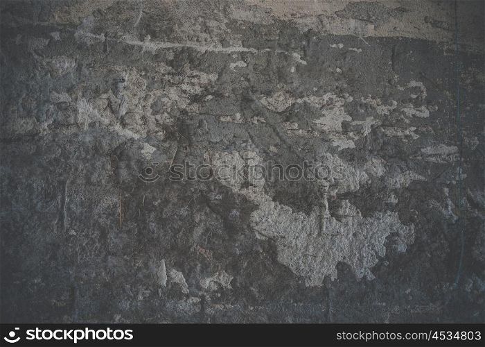 Spooky grunge background of a dark concrete wall