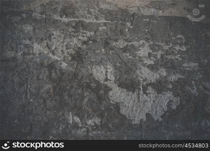Spooky grunge background of a dark concrete wall