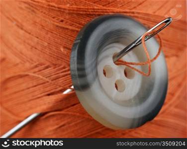 spool of thread and buttons isolated on white background