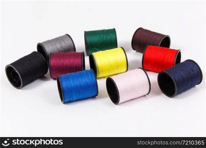 Spools of colorful thread as accessories for using in sewing and needlework. Spools of colorful thread as accessories for using in sewing.